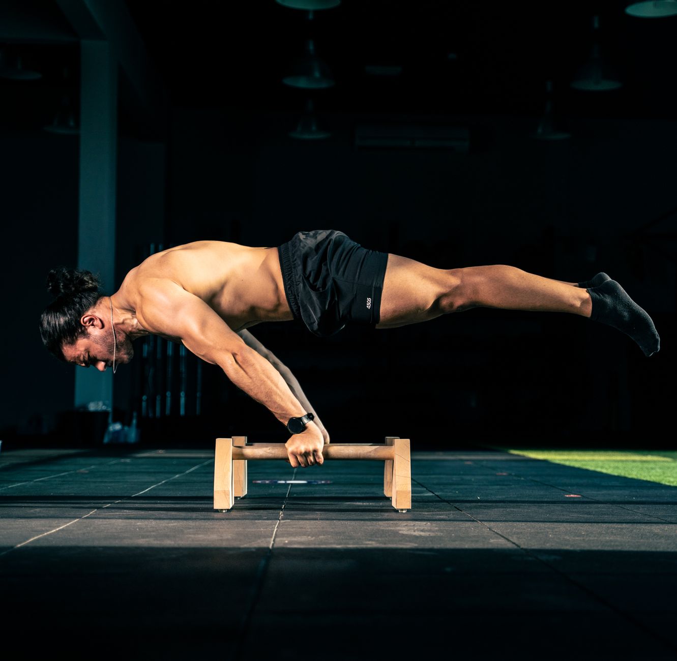 Our Favorite Calisthenics Parallette Bar Progressions for Beginners to Advanced